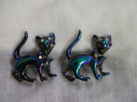 two blue cat brooches with rhinestone eyes